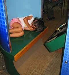 We couldn't resist...sleeping in the photo booth...