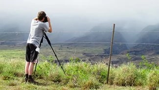 Carl photographing a distant canyon. Photo by Bev Amoth
