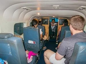 Mokulele pilot, baggage handler, and flight attendant.