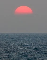 Sun setting off of the Kohala Coast, Big Island, Hawaii. © Carl Amoth
