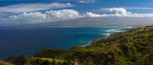 View of Haleakala Mountain on the horizon from the Kahekili Highway in Northwestern Maui. © Carl Amoth