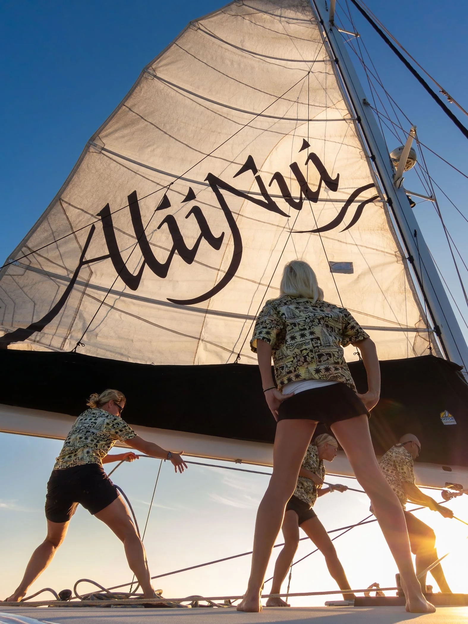 The crew of the Alii Nui hoisting the mainsail. Bev & I enjoyed a fantastic food & wine sunset cruise aboard this wonderful 65′ catamaran. BTW, Alii Nui is Hawaiian, and means “Of Highest Royalty”–perfect sailing vessel for “Princess Bev.”