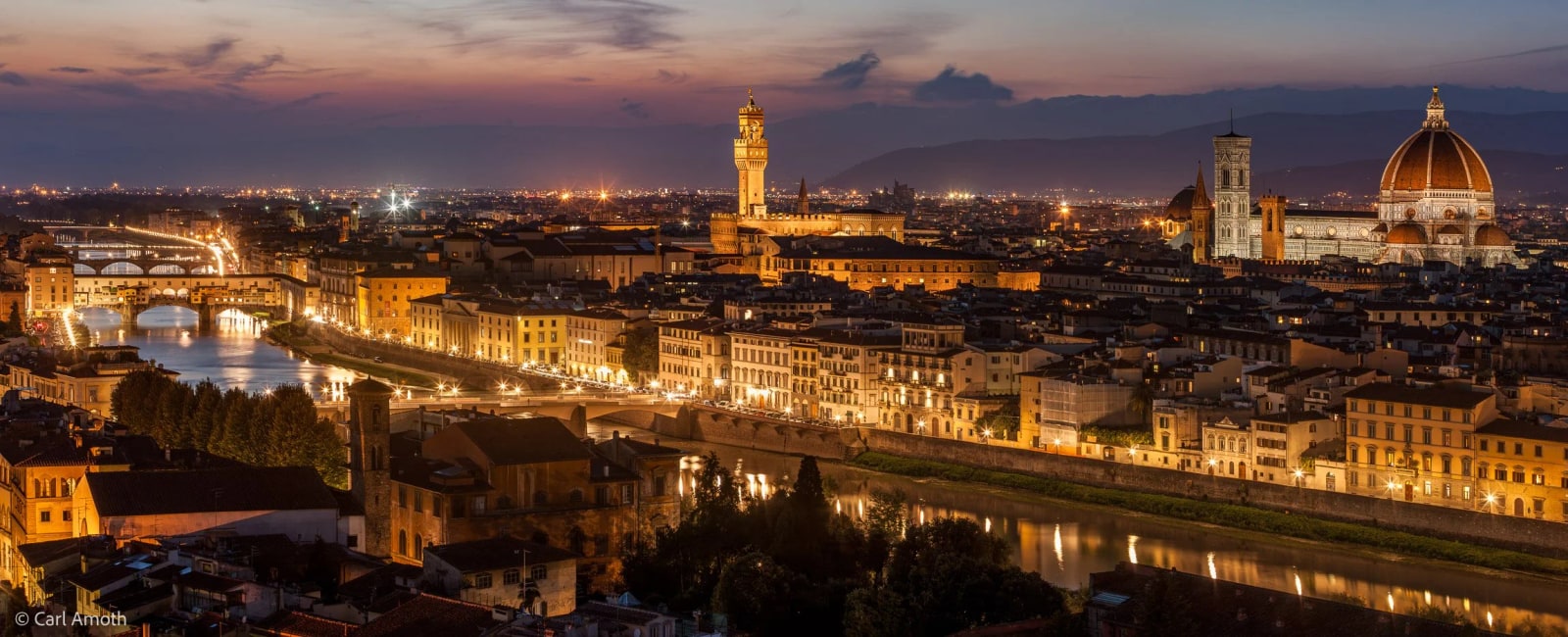 Florence at dusk, with the Arno River, Ponte Vecchio, and Duomo creating a timeless panorama from Piazzale Michelangelo