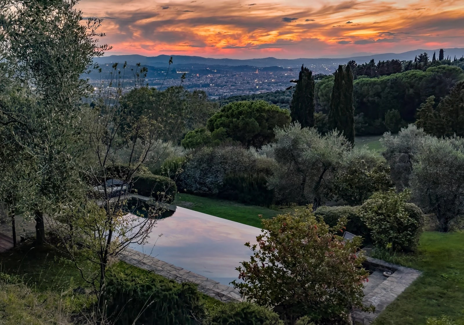 Evening view of our villa's pool and Florence beyond