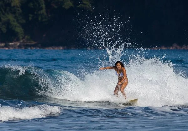 Surfing the Waipi’o Valley coastal waters, Big Island, Hawaii. © Carl Amoth